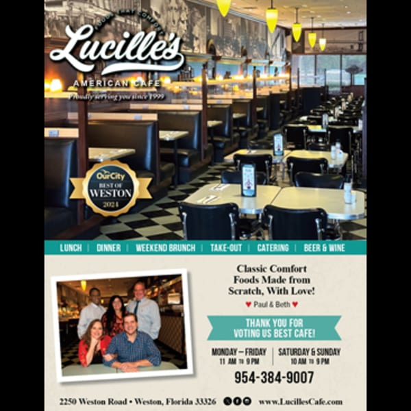 Interior of Lucille's American Cafe with booths, tables, and a checkered floor, featuring a "Best of Weston" award.