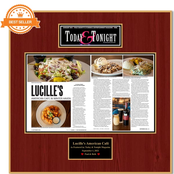 A framed magazine article about Lucille's American Cafe, featuring food photos and text.