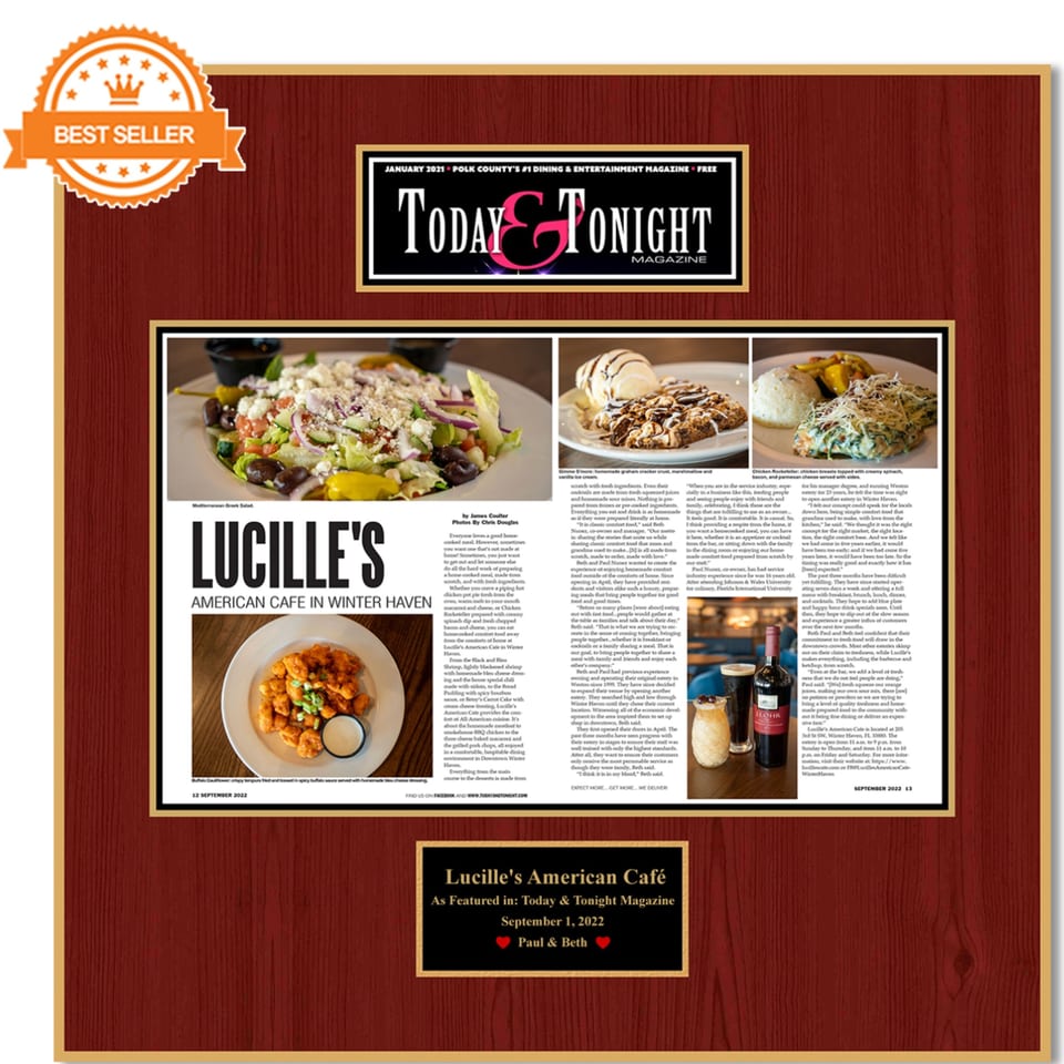 A framed magazine article about Lucille's American Cafe, featuring food photos and text.